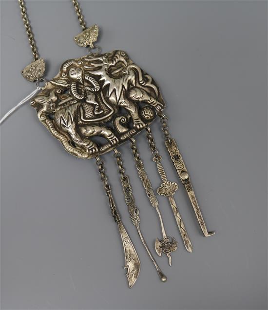 A Chinese white metal pendant